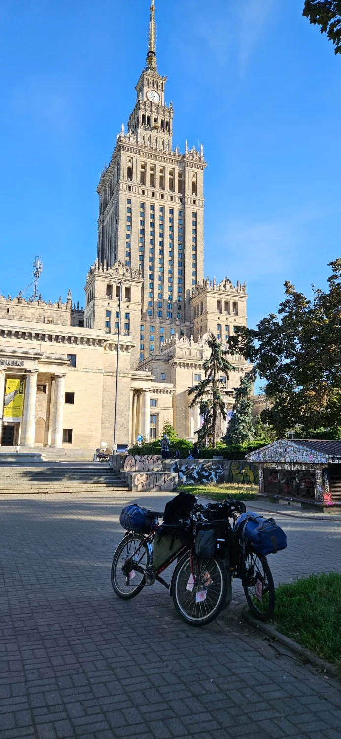 A picture of 2 bikes outside the Palace of science and culture 